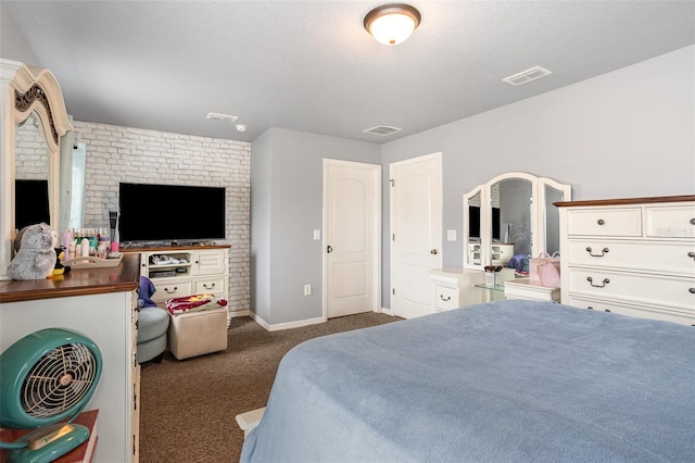 carpeted bedroom with a textured ceiling