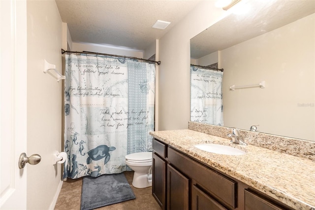 bathroom with toilet, tile patterned floors, a textured ceiling, a shower with curtain, and vanity