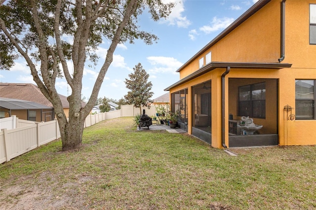 view of yard with a patio area and a sunroom