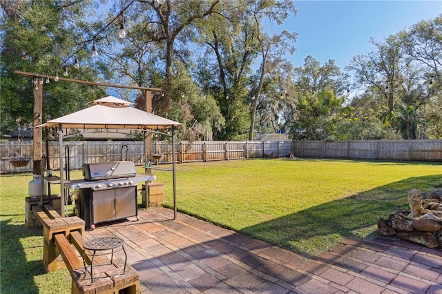 view of yard with a gazebo and a patio