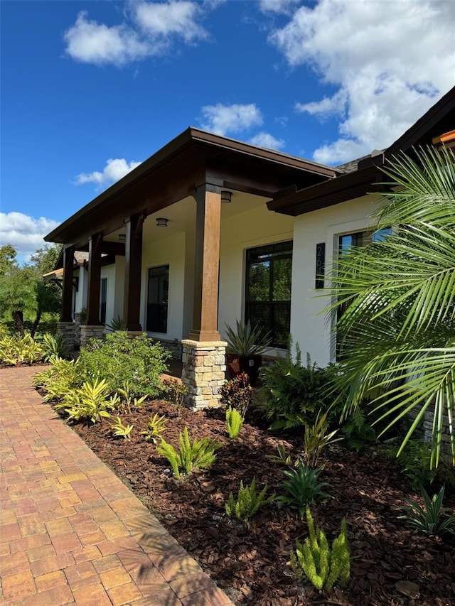 view of side of home featuring stucco siding