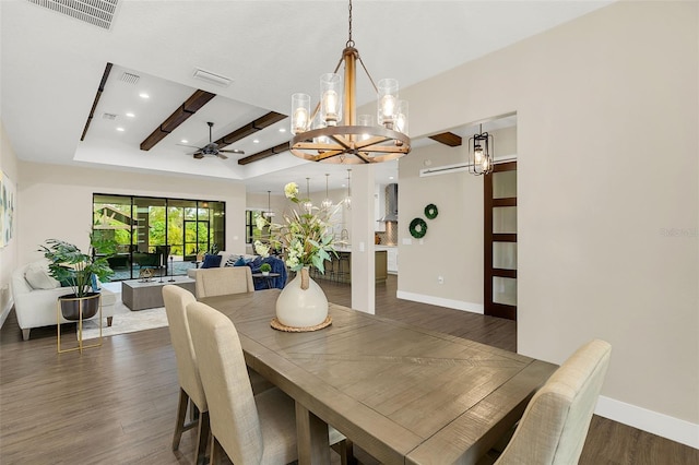 dining space featuring ceiling fan with notable chandelier, dark hardwood / wood-style floors, and beam ceiling