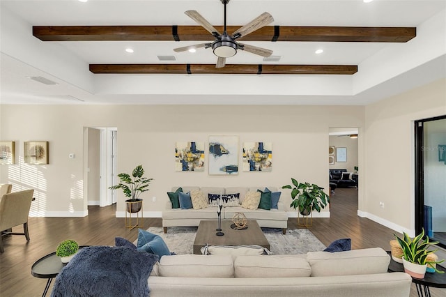 living room featuring beam ceiling, ceiling fan, and dark wood-type flooring