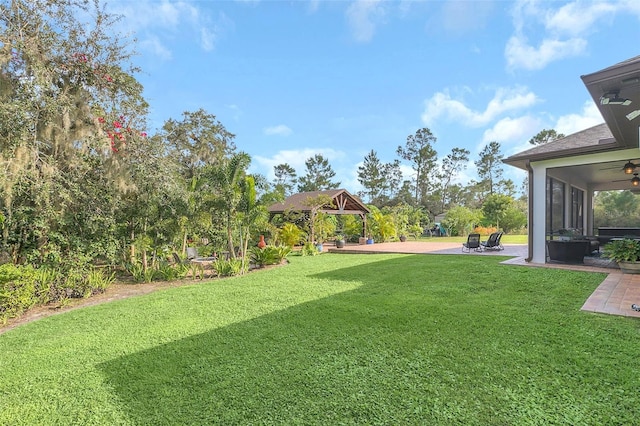 view of yard with a gazebo and a sunroom