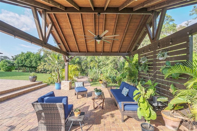 view of patio / terrace with ceiling fan and an outdoor living space