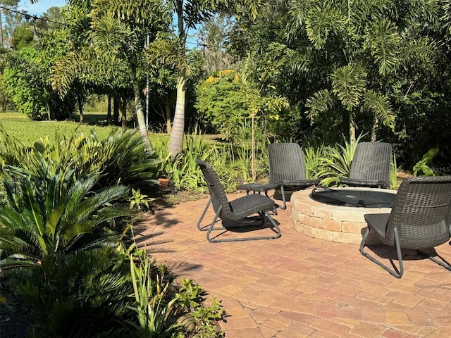 view of patio with a fire pit