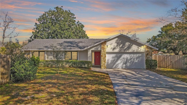 view of front of home featuring a yard and a garage