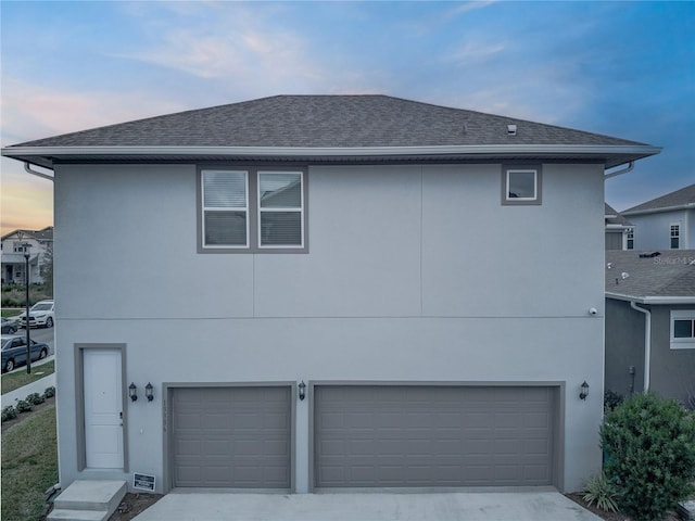 view of front of home with a garage