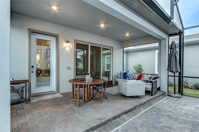 view of patio / terrace featuring a lanai