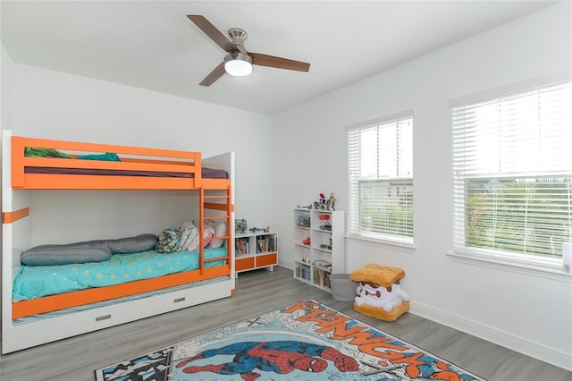 bedroom featuring wood-type flooring and ceiling fan