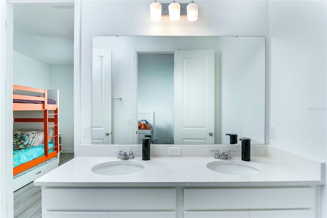 bathroom with vanity and hardwood / wood-style flooring