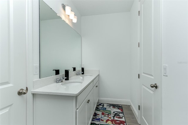 bathroom featuring hardwood / wood-style floors and vanity