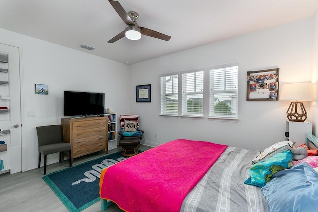 bedroom featuring ceiling fan and light wood-type flooring