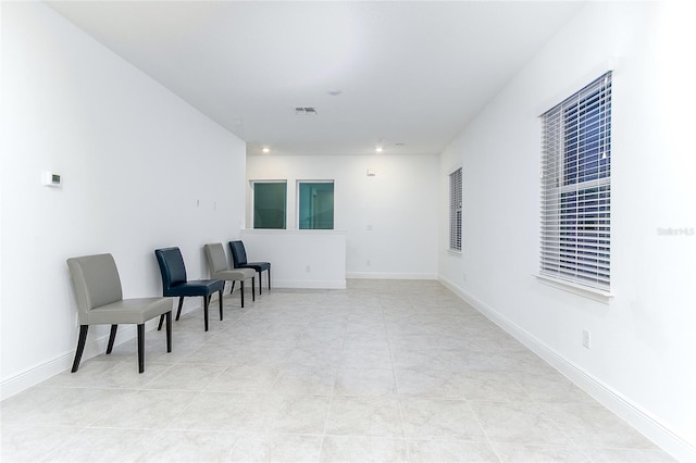 living area featuring light tile patterned floors