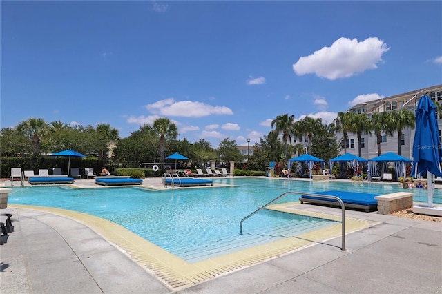 view of swimming pool with a patio area and pool water feature