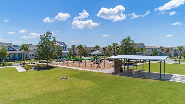 surrounding community featuring a lawn and a playground