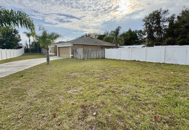 view of yard with a garage