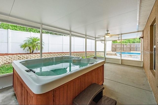 sunroom / solarium with a hot tub