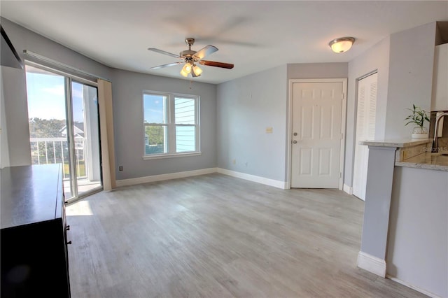 interior space featuring light hardwood / wood-style flooring and ceiling fan