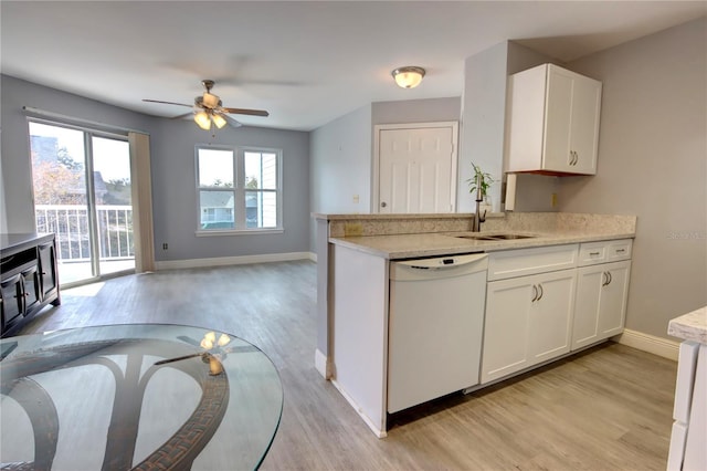 kitchen with white dishwasher, sink, light hardwood / wood-style flooring, ceiling fan, and white cabinetry