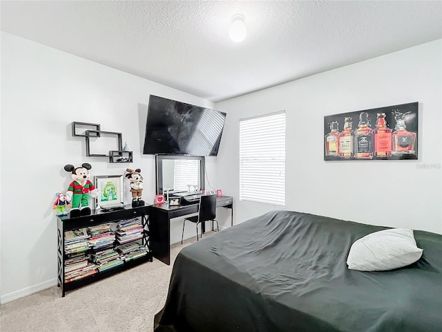 carpeted bedroom with a textured ceiling