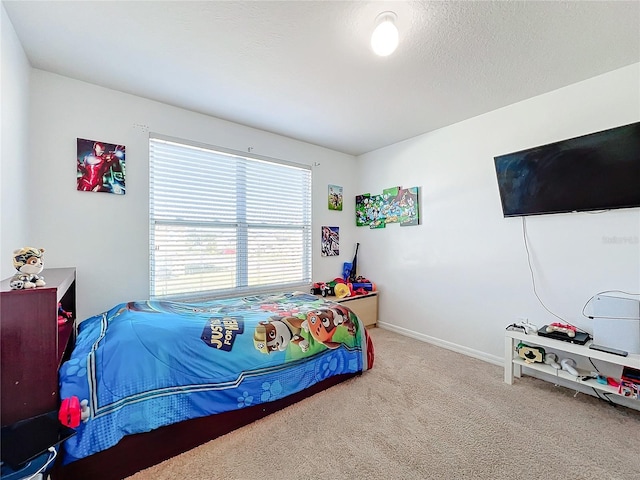 bedroom with carpet flooring and a textured ceiling