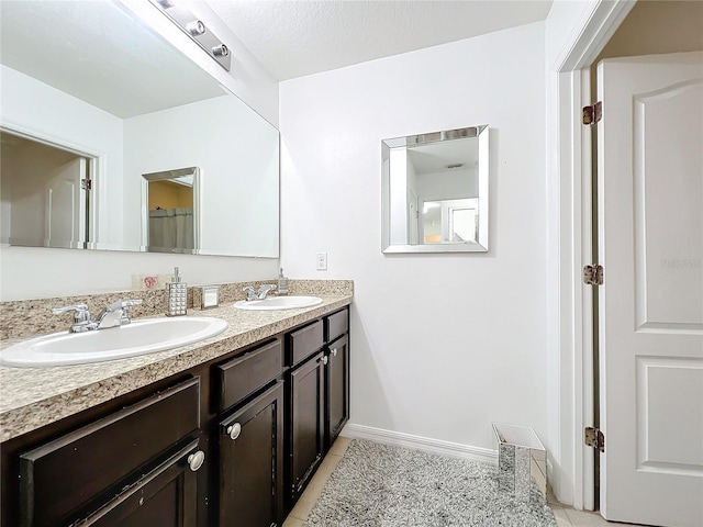 bathroom with vanity and tile patterned floors