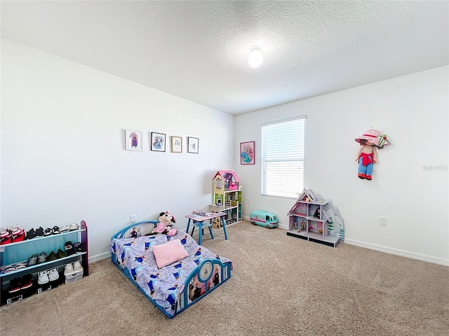 bedroom featuring carpet flooring and a textured ceiling