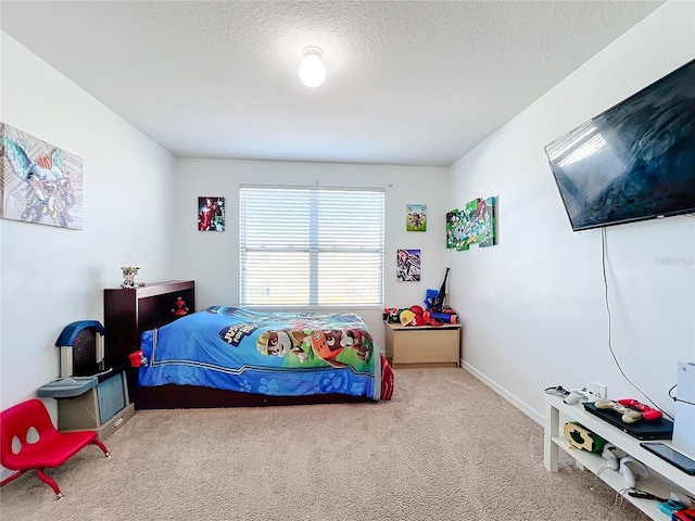 carpeted bedroom with a textured ceiling