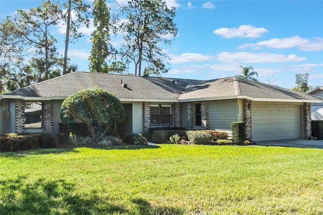 ranch-style home with a garage and a front lawn