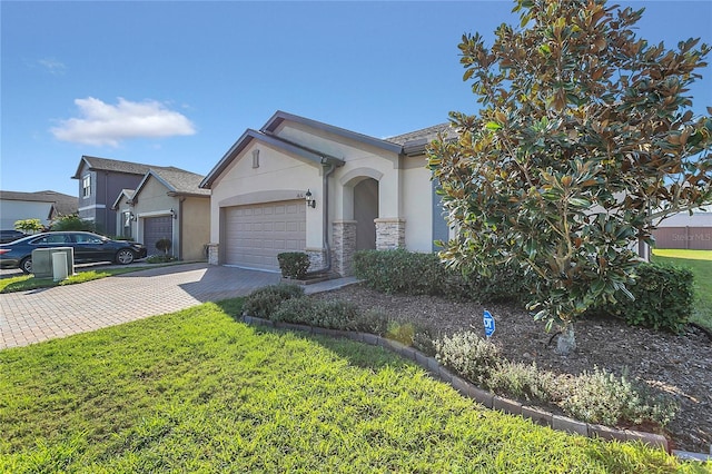 ranch-style home featuring a garage and a front lawn