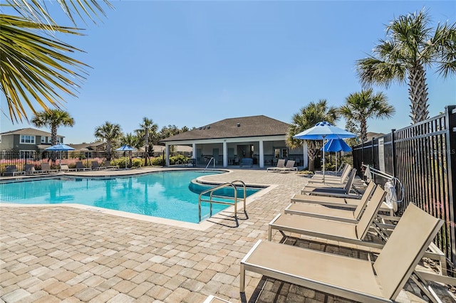 view of swimming pool with a patio