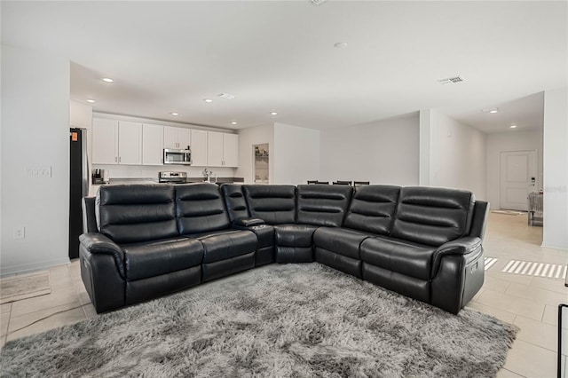 living room with light tile patterned flooring