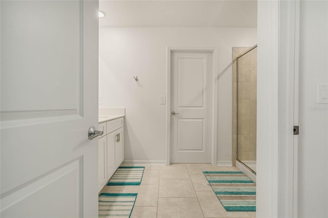 bathroom featuring vanity, tile patterned floors, and an enclosed shower