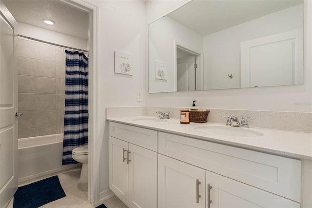 full bathroom with shower / tub combo, tile patterned floors, vanity, a textured ceiling, and toilet