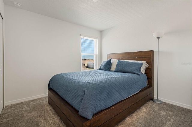 bedroom with dark carpet