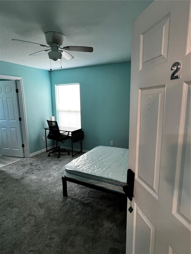 carpeted bedroom with ceiling fan