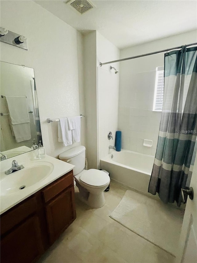 full bathroom featuring shower / tub combo with curtain, vanity, and toilet