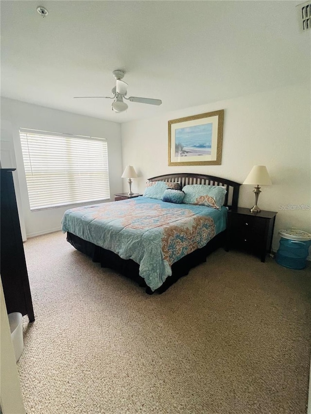 carpeted bedroom featuring ceiling fan