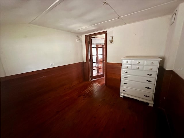 spare room with dark hardwood / wood-style flooring