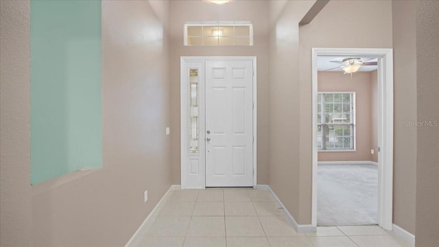 foyer entrance featuring light tile patterned flooring