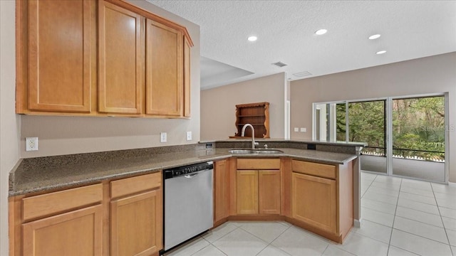 kitchen with dishwasher, sink, light tile patterned flooring, and kitchen peninsula