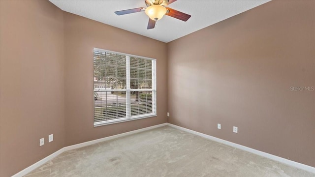 carpeted empty room with ceiling fan