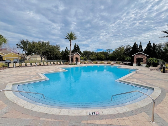 view of swimming pool featuring a patio