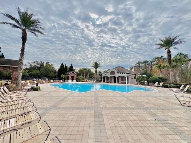 view of swimming pool with a patio