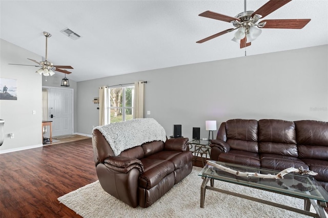 living room with ceiling fan, wood-type flooring, and vaulted ceiling