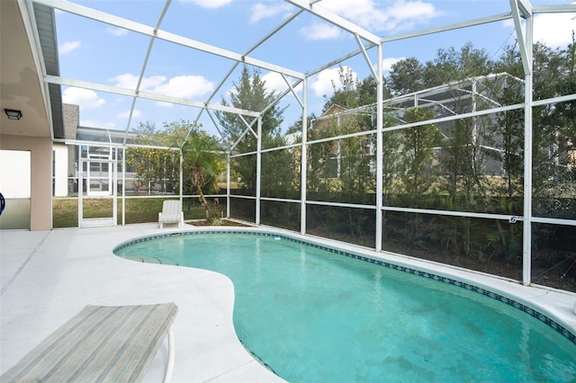 view of pool with a lanai and a patio area