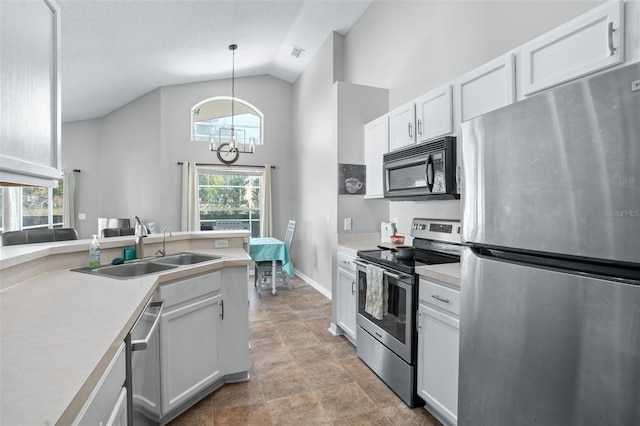 kitchen with sink, hanging light fixtures, stainless steel appliances, a notable chandelier, and white cabinets