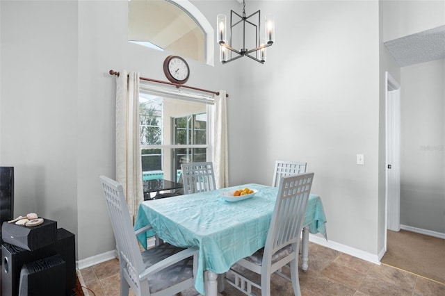 dining room with a notable chandelier