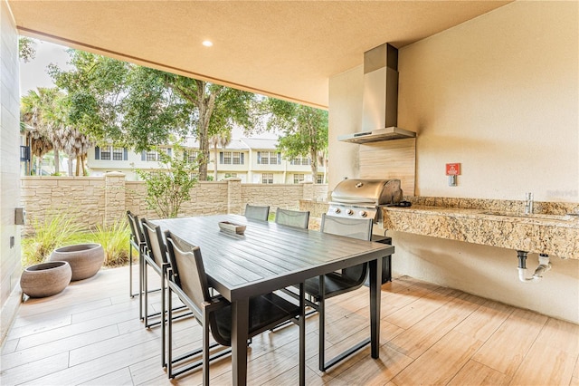 view of patio / terrace featuring area for grilling and sink